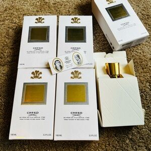Creed Fragrance Collection with Gold Accents